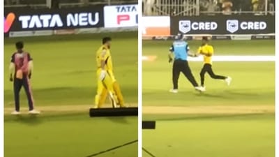 A fan ran in to the field to meet MS Dhoni A fan ran in to the field to meet MS Dhoni